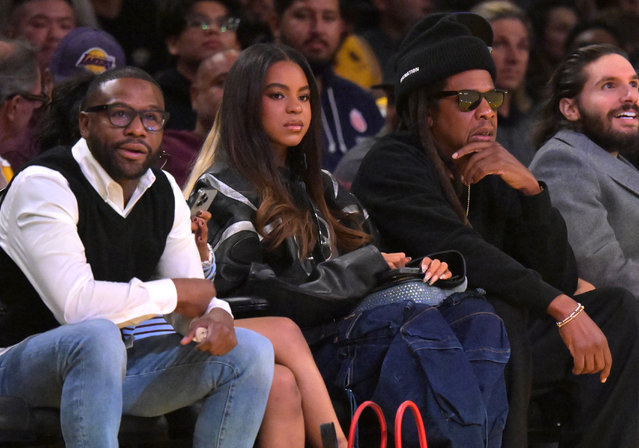 Floyd Mayweather Jr.,  former professional boxer, sits next to Blue Ivy Carter, and rapper Jay-Z as they attend the game between the Los Angeles Lakers and the San Antonio Spurs at Crypto.com Arena in Los Angeles, California on December 10, 2025. (Photo by Jayne Kamin-Oncea/Reuters)