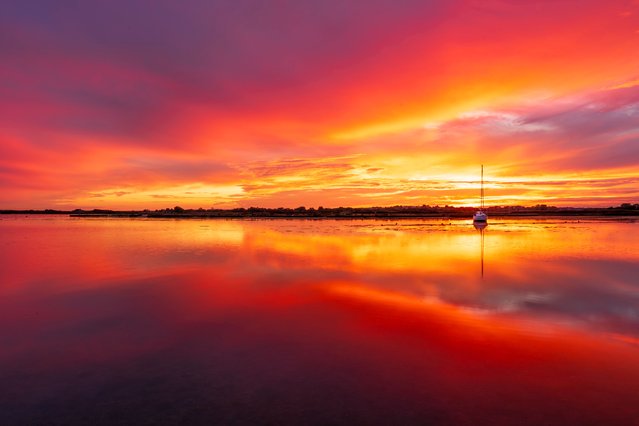 Photographer Steve Hogan captured an incredible sunset reflection in the water last night, September 30, 2025 at fisherman's bank in Christchurch, Dorset, UK. (Photo by Steve Hogan/Bournemouth News)