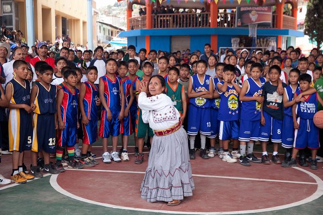 “The opening basket”. Sofia Robles, Mayor of Santa Maria Tlahuitoltepec, shoots the opening basket to inaugurate the village tournament. Location: Santa Maria Tlahuitoltepec, Oaxaca, Mexico. (Photo and caption by Jorge Santiago/National Geographic Traveler Photo Contest)