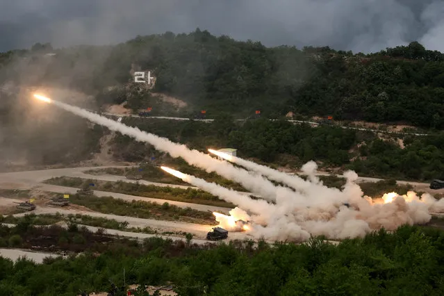 The South Korean army's multiple launch rocket systems fire rockets during South Korea-U.S. joint military drills at Seungjin Fire Training Field in Pocheon, South Korea on May 25, 2023. (Photo by South Korean Defence Ministry/Yonhap via Reuters)