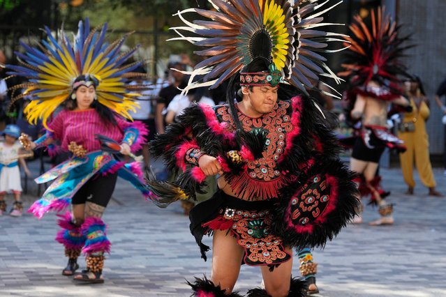 Grupo Coatlicue performs a traditional Aztec dance, an agricultural prayer ceremony in motion, during an Indigenous Peoples' Day event, Monday, October 14, 2024, in Phoenix. (Photo by Ross D. Franklin/AP Photo)