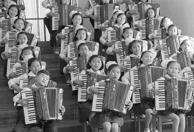 North Korean youngsters sing and play accordions to entertain foreign visitors including United Nations Secretary General Kurt Waldheim, who visited Pyongyang, May 4, 1979. Visitors report music education in North Korea begins at an early age and is taken seriously by children and adults. (Photo by Peter Arnett/AP Photo)
