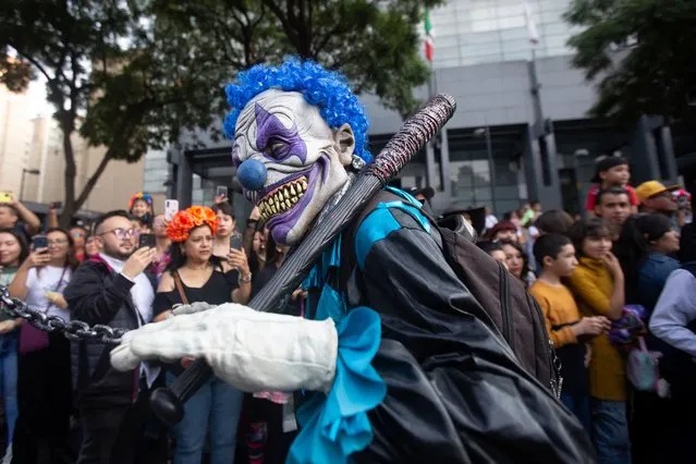 A person dressed as a zombie attends the annual Zombie Walk in Mexico City, Mexico on October 21, 2023. (Photo by Quetzalli Nicte-Ha/Reuters)