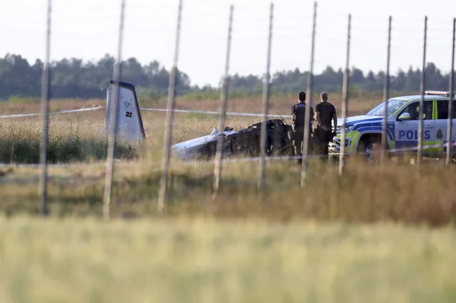 Emergency services at the scene of small aircraft crash, at Orebro Airport in Sweden, Thursday, July 8 2021. The airplane was used by the local parachute club with nine people on board. According to the police, multiple fatalites were reported. (Photo by Jeppe Gustafsson/TT News Agency via AP Photo)