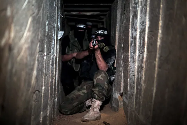 Armed Izz ad-Din al-Qassam Brigades, military wing of Hamas, deploy at a tunnel in Shujaya neighborhood of Gaza City, Gaza on August 17, 2014. (Photo by Mustafa Hassona/Anadolu Agency/Getty Images)