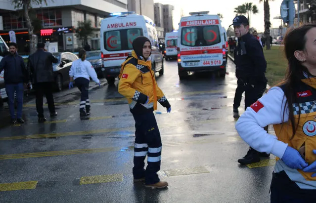 Medics arrive at the scene after an explosion outside a courthouse in Izmir, Turkey, January 5, 2017. (Photo by Hakan Akgun/Reuters)