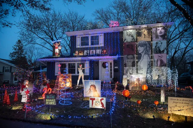 A home in Naperville, a suburb of Chicago in Illinois, is covered in Taylor Swift pictures, lyrics and blown-up album covers along with holiday lights on November 29, 2023. (Photo by Joeff Davis/Rex Features/Shutterstock)