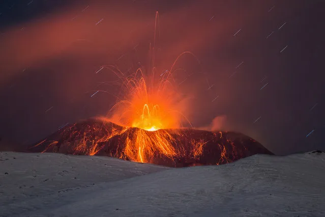 Strombolian activity seen from the Southeast Crater of Etna volcano on January 31, 2017 in Catania, Italy. Footage from the South slope of the Mount Etna volcano, a few km from the city of Catania, shows Strombolian explosions beyond the crater rim with emission of ash. (Photo by Marco Restivo/Barcroft Images)