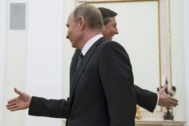 Russian President Vladimir Putin (front) and his Slovenian counterpart Borut Pahor shake hands with members of the delegations during a meeting at the Kremlin in Moscow, Russia, February 10, 2017. (Photo by Alexander Zemlianichenko/Reuters)