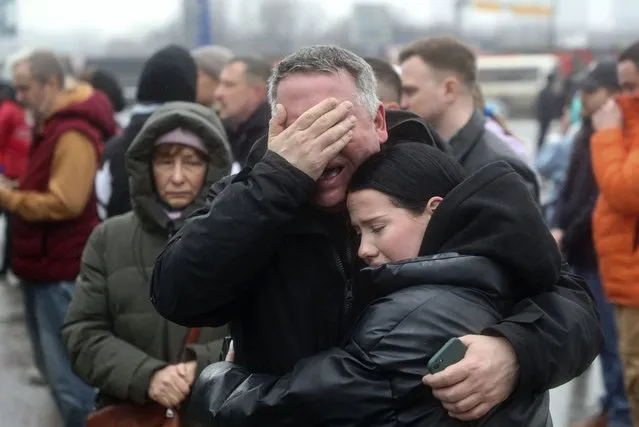 People mourn at the Crocus City Hall concert venue following a terrorist attack in Krasnogorsk, outside Moscow, Russia, 23 March 2024. On 22 March evening, a group of up to five gunmen attacked the Crocus City Hall in the Moscow region, Russian emergency services said. At least 115 people were killed and more than 100 others were hospitalized, the Investigative Committee confirmed. The head of the Russian FSB, Alexander Bortnikov, reported to Russian President Vladimir Putin on 23 March on the arrest of 11 people, including all four terrorists directly involved in the terrorist attack. (Photo by Maxim Shipenkov/EPA)
