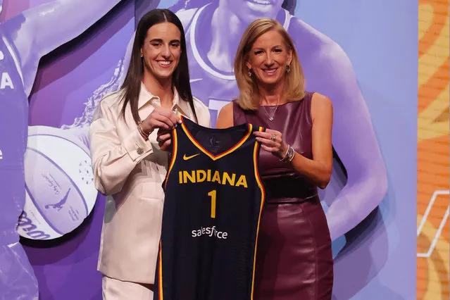 American basketball player Caitlin Clark poses with WNBA commissioner Cathy Engelbert after she is selected with the number one overall pick to the Indiana Fever in the 2024 WNBA Draft at the Brooklyn Academy of Music on April 15, 2024. (Photo by Brad Penner/USA TODAY Sports)