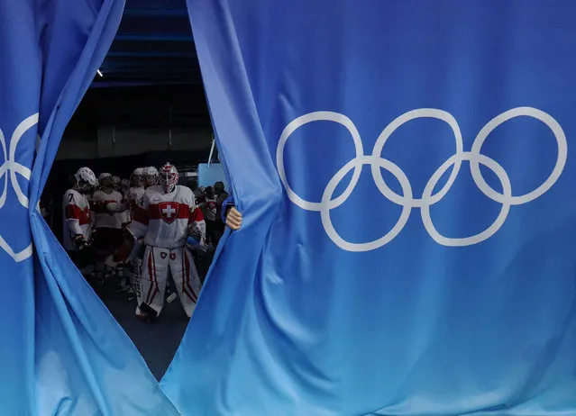 Switzerland players are seen in the tunnel during a break in their ice hockey women’s quarter-finals against Russian Olympic Committee at Wukesong Sports Centre in Beijing, China on February 12, 2022. (Photo by Brian Snyder/Reuters)