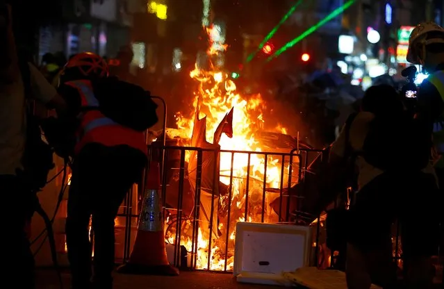 A barricade on fire is pictured during a protest near Mong Kok police station in Hong Kong, September 7, 2019. Hong Kong police fired tear gas to disperse protesters in the Kowloon district of Mong Kok for a second night on Saturday, after preventing demonstrators from reaching the airport earlier in the day. (Photo by Amr Abdallah Dalsh/Reuters)