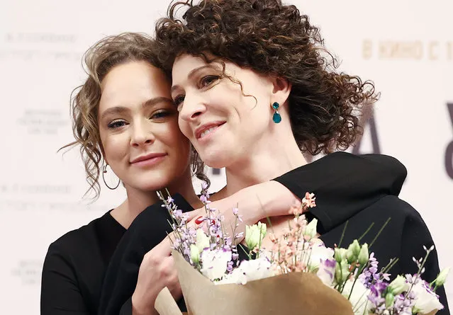 Actresses Ksenia Rappoport (R) and Aglaya Tarasova attend the Moscow premiere of Vladimir Bitokov's film Mama, I'm Home at the Khudozhestvenny cinema in Moscow, Russia on February 2, 2022. The film premiered at the 78th Venice International Film Festival. (Photo by Artyom Geodakyan/TASS)