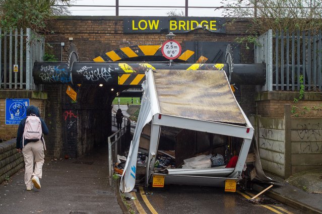 A van has smashed into the railway bridge in Station Road, Slough, UK near Burnham Station on February 29, 2024. The low bridge which is clearly marked as a low bridge and has a flashing sign to warn vehicles that is a low bridge, is underneath the railway line used by Elizabeth Line and GWR trains. Trains are however still running. (Photo by Maureen McLean/Rex Features/Shutterstock)