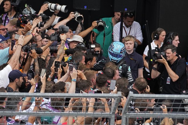 Photographers struggle to take photos of Mercedes driver George Russell of Britain after he won the Austrian Formula One Grand Prix race at the Red Bull Ring racetrack in Spielberg, Austria, Sunday, June 30, 2024. (Photo by Darko Bandic/AP Photo)