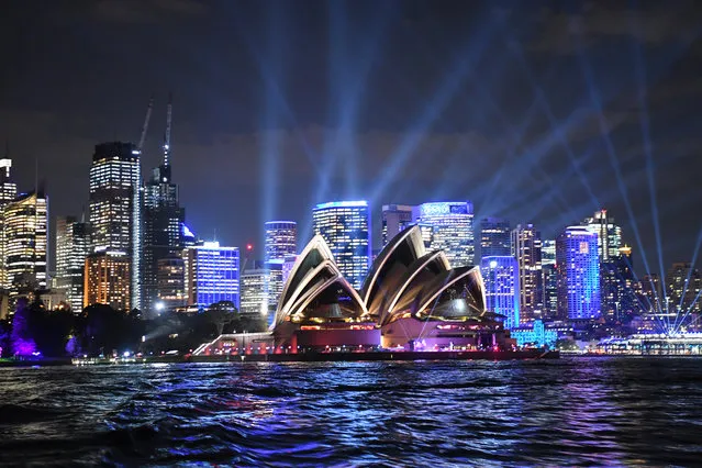 The Opera House and CBD are lit with special lighting during the media preview of Vivid Sydney on May 23, 2019 in Sydney, Australia. “Vivid Sydney” runs from May 24 throughout the city and suburbs of Sydney with hundreds of illuminated buildings and exhibits which attract hundreds of thousands of visitors each year. (Photo by James D. Morgan/Getty Images)