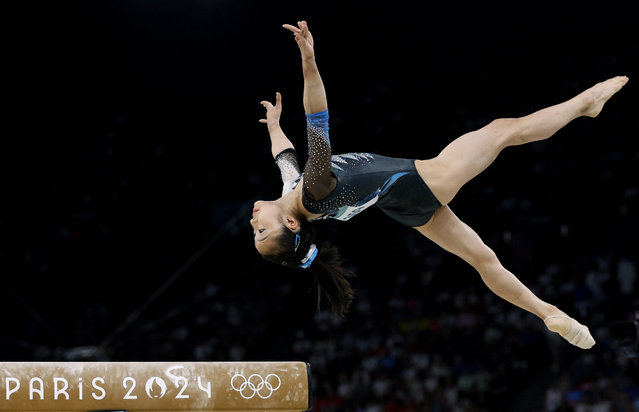 Mana Okamura of Japan performs her routine on the balance beam in the women’s team final in artistic gymnastics in Paris on July 30, 2024. The four-member team finished eighth. (Photo by Amanda Perobelli/Reuters)