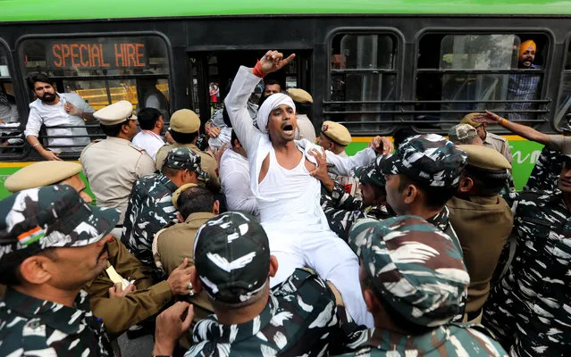 Indian youth congress workers shout anti-demonetisation slogans as they are detained by the police during a protest near the Reserve Bank of India (RBI) in New Delhi, India, 08 November 2019. Indian Youth Congress workers protested outside the RBI to highlight alleged issues facing the nation since last three years under the Modi regime after demonetisation, a news reports said. (Photo by Rajat Gupta/EPA/EFE)