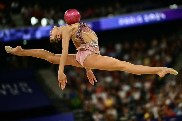 Italy's Sofia Raffaeli performs with the ball as she competes in the rhytmic gymnastics' individual all-around qualification during the Paris 2024 Olympic Games at the Porte de la Chapelle Arena in Paris, on August 8, 2024. (Photo by Loic Venance/AFP Photo)