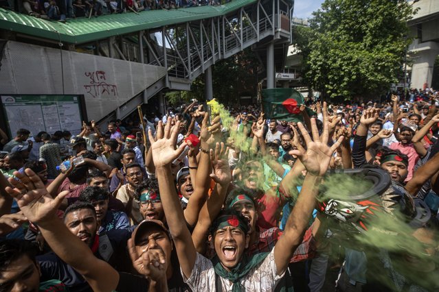 Protesters shout slogans as they celebrate Prime Minister Sheikh Hasina's resignation, in Dhaka, Bangladesh, Monday, August 5, 2024. (Photo by Rajib Dhar/AP Photo)