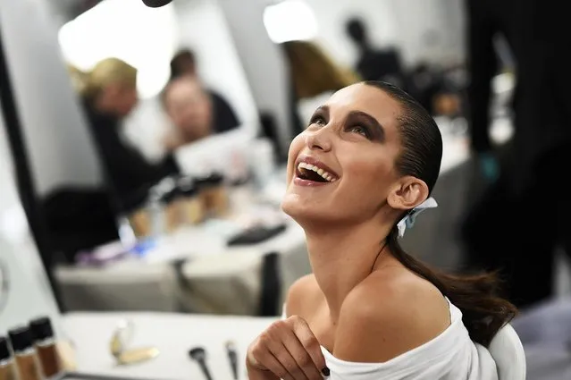 Model Bella Hadid smiles as she has her make-up applied inside Blenheim Palace ahead of a fashion show presenting the Dior, Cruise 2017 Collection, in Woodstock, Britain May 31, 2016. (Photo by Dylan Martinez/Reuters)
