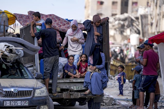 Palestinians displaced by the Israeli air and ground offensive on the Gaza Strip flee from Hamad City, following an evacuation order by the Israeli army to leave parts of the southern area of Khan Younis, Sunday, August 11, 2024. (Photo by Abdel Kareem Hana/AP Photo)