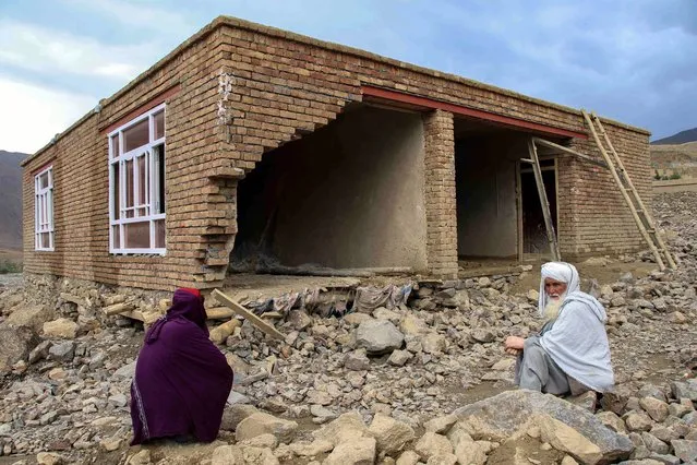 People salvage their belongings from damaged houses in flash floods, in Siagard, Parwan province, Afghanistan, 05 May 2022. At least 22 people died and 30 wounded in Afghanistan due to flash floods triggered by the torrential rain which has been lashing the country in recent days. “The recent rains caused 22 deaths, 30 wounded, and a number of animals, hundreds of homes and several hectares of agriculture land getting destroyed”, the spokesperson of the disaster management ministry, Mahammad Nasim Haqqani said. (Photo by EPA/EFE/Stringer)