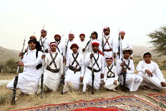 Men pose for a photo during a traditional excursion near the western Saudi city of Taif, August 8, 2015. (Photo by Mohamed Al Hwaity/Reuters)