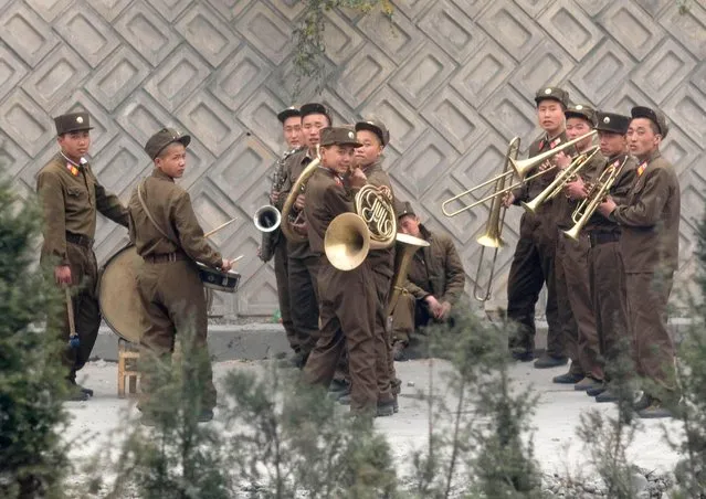 Workers on the highway were reparaing the road on the left side. On the right side, a live orchestra was playing! Me: What is the orchestra doing on the highway??? My guide: Mr Eric, they are playing for the workers... it’s nicer to work with music, is it not? (Photo by Eric Lafforgue/Exclusivepix Media)