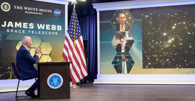 In this handout provided by the National Aeronautics and Space Administration (NASA), U.S. President Joe Biden previews the first full-color image from NASA's James Webb Space Telescope, the highest resolution image available of the infrared universe, in the South Court Auditorium in the Eisenhower Executive Office Building of the White House July 11, 2022 in Washington, DC. Joining the president and Vice President Kamala Harris for the event via video link were NASA Associate Administrator for the Science Mission Directorate Thomas Zurbuchen (Top), Deputy Director of the Space Telescope Science Institute Nancy Levenson (Middle) and program Director Greg Robinson (Bottom). (Photo by Bill Ingalls-NASA via Getty Images)