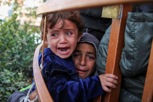 Children cry during the funeral of Palestinian Anas Al-Masri, who succumbed to wounds sustained from an Israeli strike, in Khan Younis in the southern Gaza Strip, on November 19, 2024. (Photo by Hatem Khaled/Reuters)