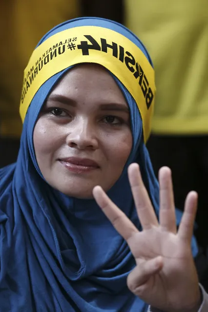 A woman participant shows the support for the rally of pro-democracy group “Bersih” (Clean) in Kuala Lumpur, Malaysia, Saturday, August 29, 2015. (Photo by Lai Seng Sin/AP Photo)