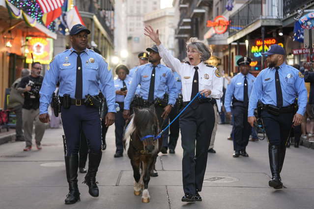 New Orleans Police Superintendent Anne Kirkpatrick waves as she walks down Bourbon Street with Patch, the department's mini horse, in the French Quarter Wednesday, February 5, 2025, ahead of Super Bowl 59 between the Philadelphia Eagles and the Kansas City Chiefs in New Orleans. (Photo by Gerald Herbert/AP Photo)