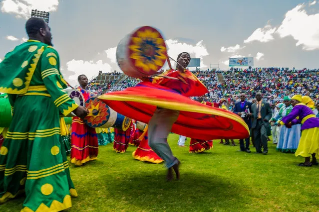 Zimbabwean worshippers and congregants from various indigenous church denominations perform and dance as they wait to be addressed by Zimbabwe first lady Grace Mugabe (not in picture) at a religious gathering rally organised by Zimbabwean ruling party Zimbabwe African National Union- Patriotic Front (Zanu PF) Harare Youth Province  on November 5, 2017, in Harare. Grace Mugabe, 41 years younger than her husband, has become increasingly active in public life in what many say is a political grooming process  to help her eventually take the top job. (Photo by Jekesai Njikizana/AFP Photo)