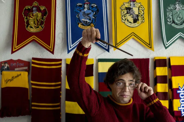 Menahem Asher Silva Vargas, a 37 year old lawyer, jokes around with a Harry Potter wand and glasses, during an interview at his home after receiving the Guinness World Record title for the largest collection of Harry Potter memorabilia, in Mexico City, Monday, September 29, 2014. Silva's 14 year old collection consists of more than 3000 individual items, including figurines, trading cards, wands, clothing, and accessories. (Photo by Rebecca Blackwell/AP Photo)