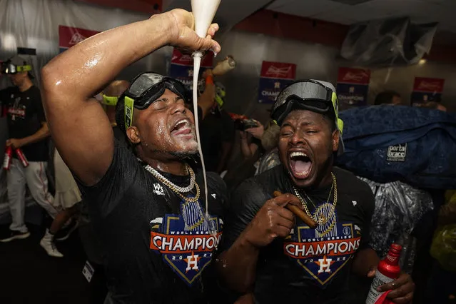 Houston Astros starting pitcher Framber Valdez, and Hector Neris celebrate in the locker room after their 4-1 World Series win against the Philadelphia Phillies in Game 6 on Saturday, November 5, 2022, in Houston. (Photo by David J. Phillip/AP Photo)
