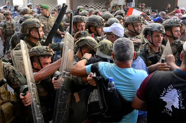 Lebanese army soldiers clash with protesters outside of the Lebanese parliament, where lawmakers attend a parliament session to approve the 2022 budget in downtown Beirut, Lebanon, 26 September 2022.  Retired army soldiers have gathered outside the Lebanese Parliament during a session to approve the 2022 budget to demand higher pensions. (Photo by Wael Hamzeh/EPA/EFE/Rex Features/Shutterstock)