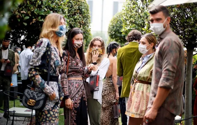 Guests are seen at the end of the Etro Spring/Summer 2021 Men's collection and Women's pre-collection livestreamed show at the Four Seasons hotel, amid the coronavirus outbreak, during Milan Digital Fashion Week in Milan, Italy, July 15, 2020. (Photo by Alessandro Garofalo/Reuters)