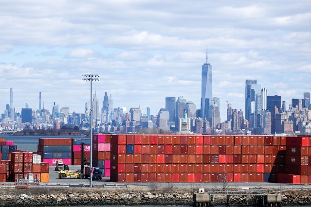 Shipping containers are seen at the Port Jersey Container Terminal, with the Manhattan skyline in the distance, in Jersey City, New Jersey on April 8, 2025. China vowed Tuesday to “fight to the end” after US President Donald Trump threatened to further ramp up tariffs but the EU warned against escalating a trade war that has rocked global markets. Trump has upended the world economy with sweeping tariffs that have raised the spectre of an international recession, but has ruled out any pause in his aggressive trade policy despite a dramatic market sell-off. (Photo by Charly Triballeau/AFP Photo)