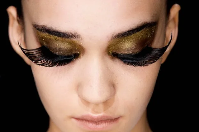 A model prepared for the fashion show by designer Guido Maria Kretschmsr during Mercedes-Benz Fashion Week for autumn-winter 2013 in Berlin, January 17, 2013. (Photo by Markus Schreiber/Associated Press)