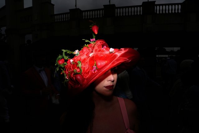 A race fan walks though the grounds at Churchill Downs before the 151st running of the Kentucky Derby horse race Saturday, May 3, 2025, in Louisville, Ky. (Photo by Brynn Anderson/AP Photo)