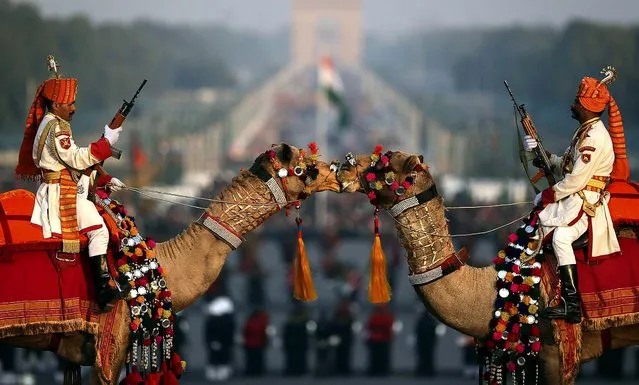 Camel-mounted Indian Border Security Force soldiers in their ceremonial dress participate in full dress rehearsals of the Beating Retreat ceremony at Raisina Hill, which houses India's most important ministries and presidential palace, in New Delh, on January 27, 2013. The ceremony is held annually on January 29, marking the end of Republic Day celebrations. (Photo by Manish Swarup/Associated Press)