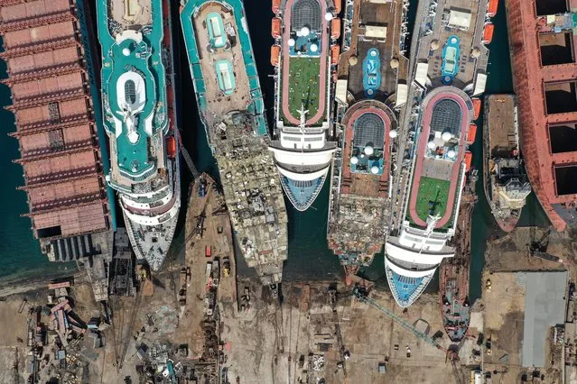 A drone image shows decommissioned cruise ships being dismantled  for scrap metal sales after the COVID-19 pandemic all but destroyed the industryat Aliaga ship-breaking yard in the Aegean port city of Izmir, western Turkey, October 2, 2020. (Photo by Umit Bektas/Reuters)