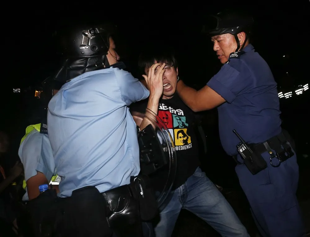 Hong Kong Protesters Scuffle with Police