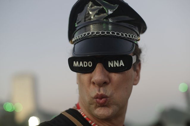 A fan strikes a pose as he waits for the start of Madonna's last show of her The Celebration Tour, on Copacabana beach in Rio de Janeiro, Brazil, Saturday, May 4, 2024. (Photo by Bruna Prado/AP Photo)