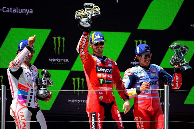 (From L) Second-placed Ducati Spanish rider Jorge Martin, winner Ducati Italian rider Francesco Bagnaia and third-placed Ducati Spanish rider Marc Marquez celebrate on the podium after the MotoGP Race of the Moto Grand Prix of Catalonia at the Circuit de Catalunya on May 26, 2024 in Montmelo on the outskirts of Barcelona. (Photo by Josep Lago/AFP Photo)