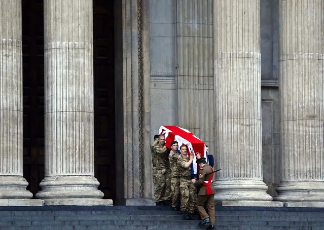 British forces carry a Union Jack-draped coffin outside St. Paul's Cathedral in central London during the rehearsal for the upcoming funeral of former British Prime Minister Margaret Thatcher on Wednesday, April 15, 2013. (Photo by Lefteris Pitarakis/Associated Press)