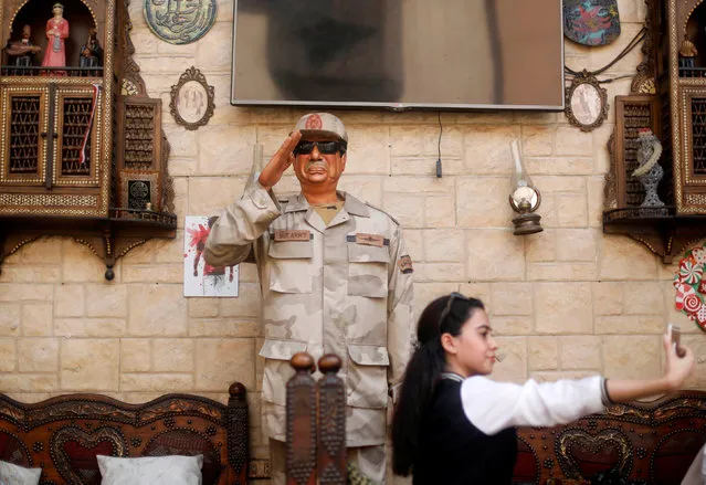 A woman takes a selfie with an effigy depicting Egyptian President Abdel Fattah al-Sisi during the second day of the presidential election in Cairo, Egypt, March 27, 2018. (Photo by Amr Abdallah Dalsh/Reuters)
