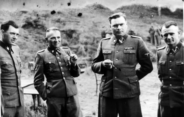 Dr Josef Mengele (1911-1979) left, known as “The Angel of Death” for the medical experiments he carried out on the inmates of Auschwitz, the German Nazi concentration. Next to him is Rudolf Hoss, Commandant of Auschwitz: Second from right is Josef Kramer, Commandant of Belsen: Right, an unidentified German officer. (Photo by Universal History Archive/Getty Images)